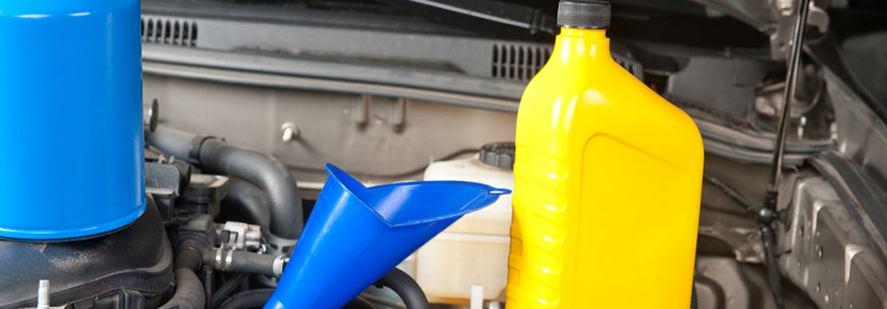 Mercedes-Benz Synthetic Motor Oil Replacement bottle of oil and funnel