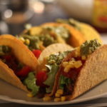 multiple tacos arranged on a plate